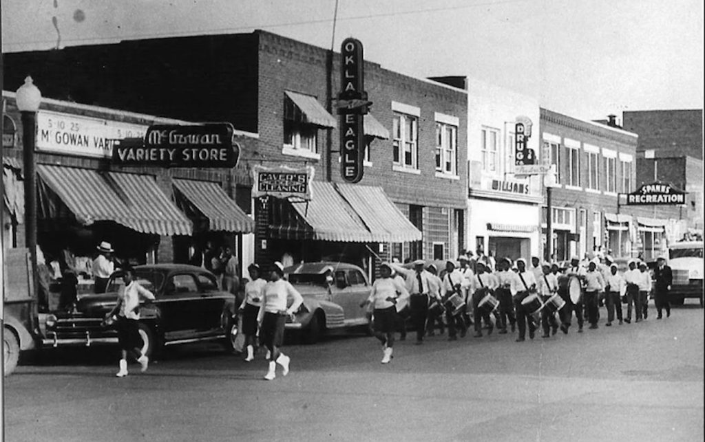 The Booker T. Washington High School parade processes along Greenwood Avenue in Tulsa, Oklahoma.