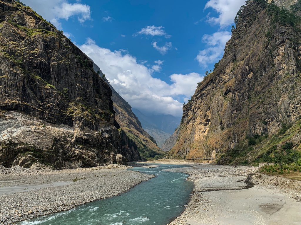 nepal water insecurity - The Budhi Gandaki River, shown here downstream from Nubri Valley, rushes with icy turquoise water.