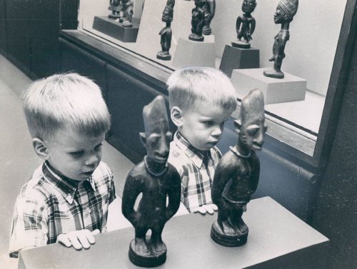 do twins share soul - The author and his twin pose with ère ìbejì on display at a 1967 Field Museum exhibition.