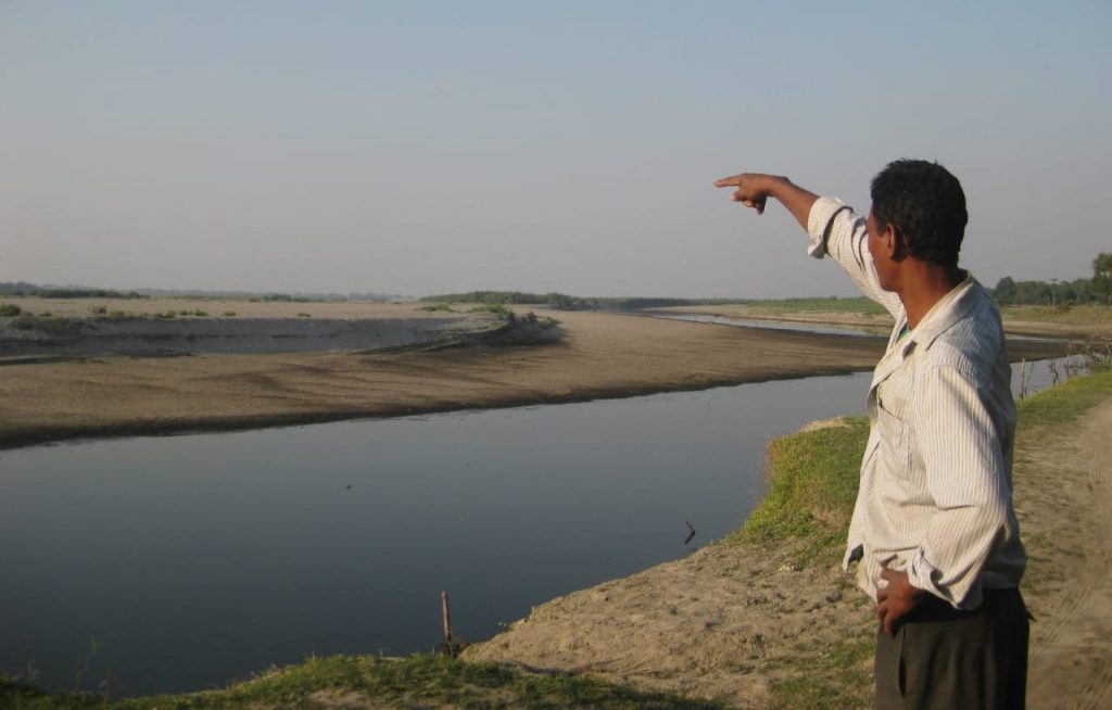Mising river people Assam India - A member of the Mising, a tribal, Indigenous community in Assam, India, explains how erosion displaced people along the banks of the Brahmaputra River.