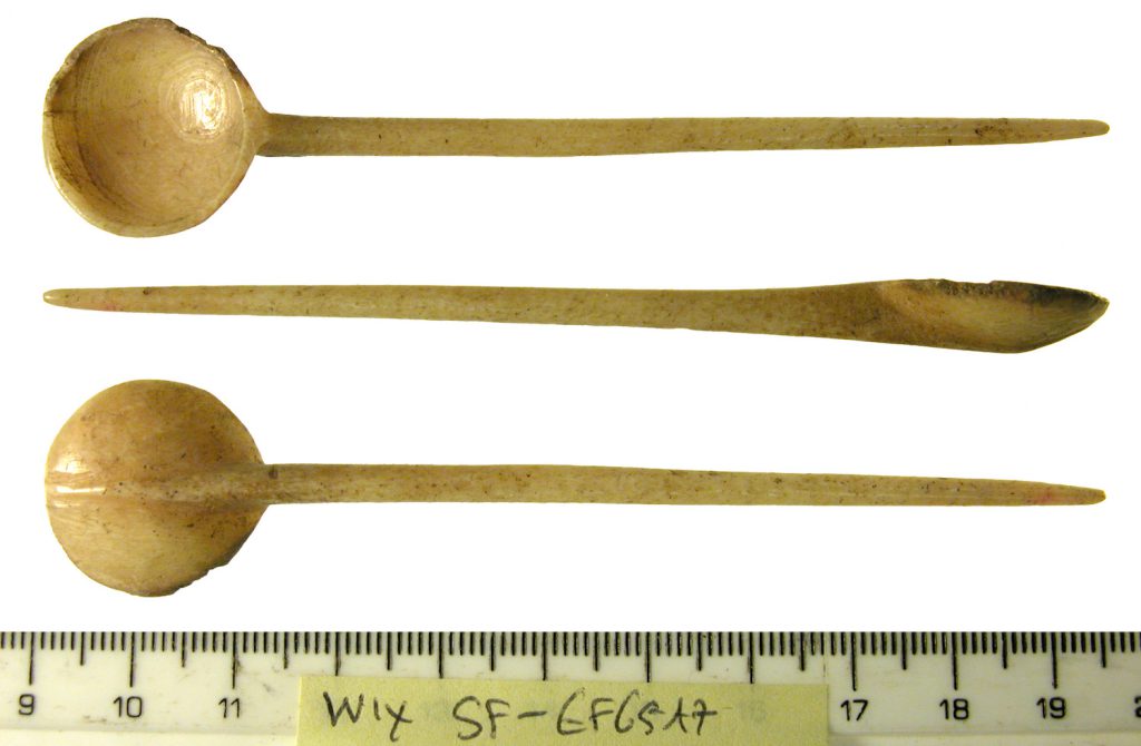 The front, side, and back views of a cream-colored bone spoon with a round face and a long handle.