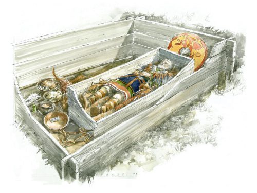 A watercolor-style illustration of a person lying in an open wooden casket with a sword beside them and a red and gold round shield behind them, surrounded by open vessels in a wooden enclosure.