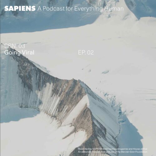 A stark white mountain landscape, with jagged peaks covered in snow.