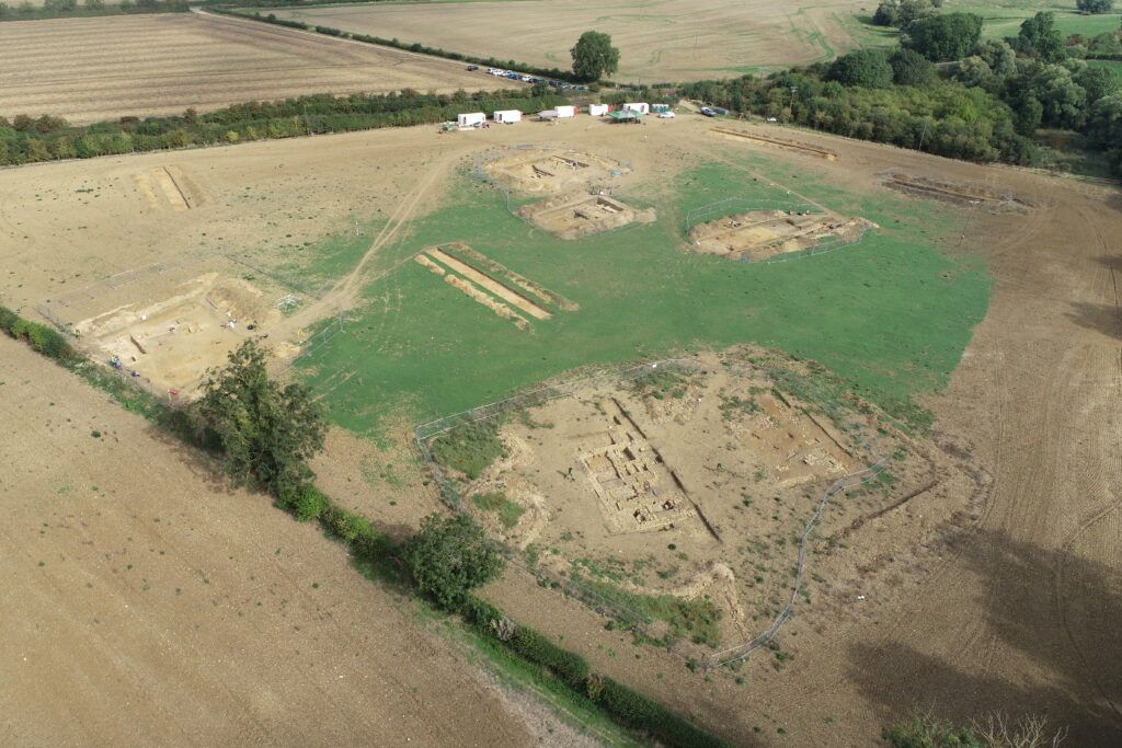 Another photograph shows a large land area with several brown, rectangular plots of various sizes separated by green grass, with a cluster of buildings in the distance.