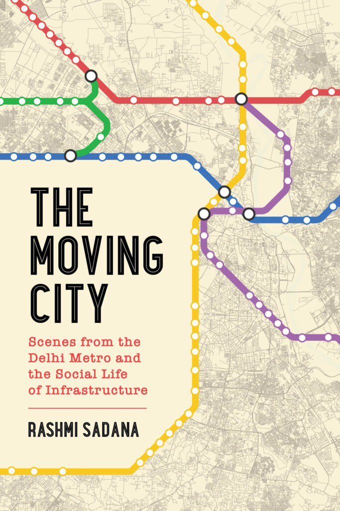 A book cover shows multicolor lines resembling a subway map. On the left, black capitalized text reads: “The Moving City,” red text below reads: “Scenes From the Delhi Metro and the Social Life of Infrastructure,” and black capitalized text at the bottom reads: “Rashmi Sadana.”