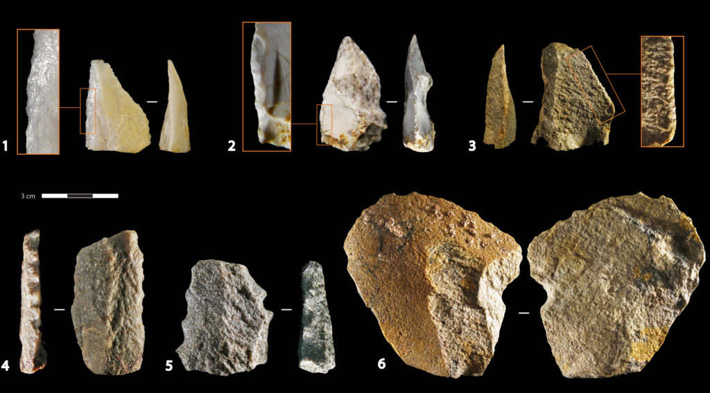 Fifteen stone objects of varying shapes and sizes are clustered in groups of two or three and labeled with numbers 1 through 6.