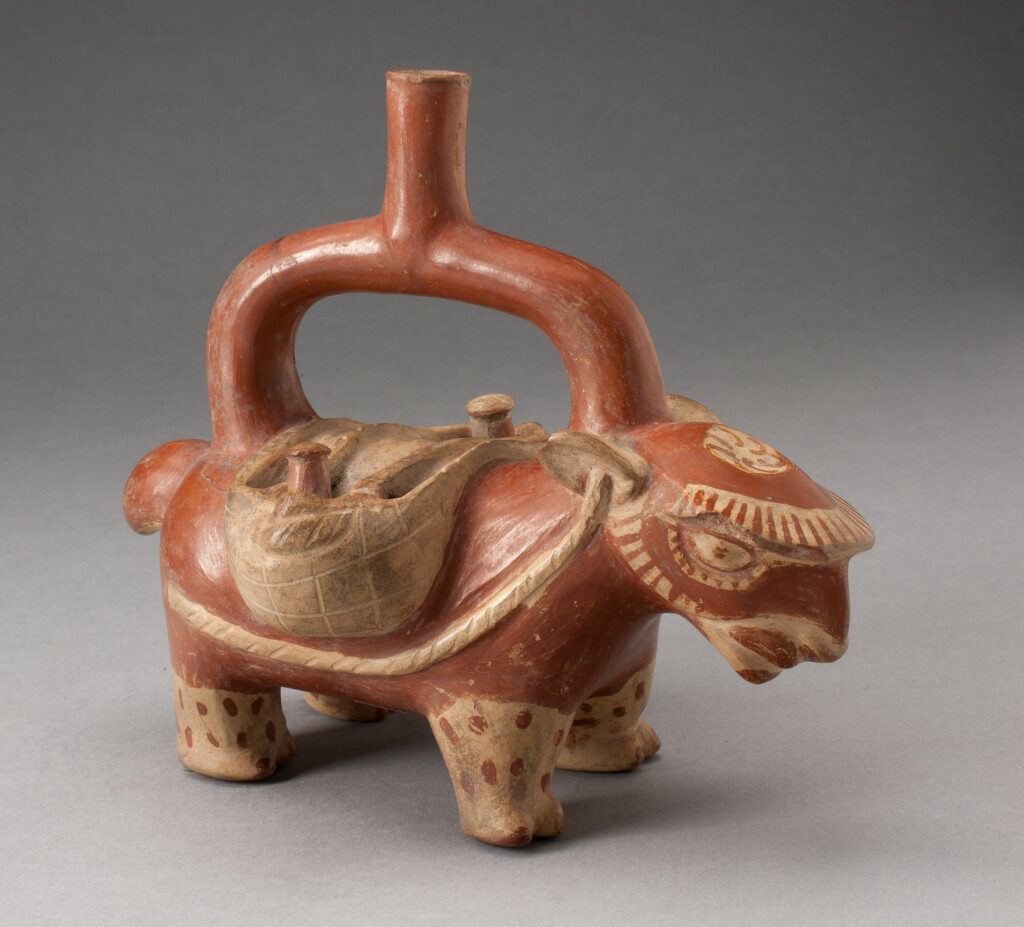 A brown ceramic figure shaped like a llama sits against an ombré background of dark gray to light gray.