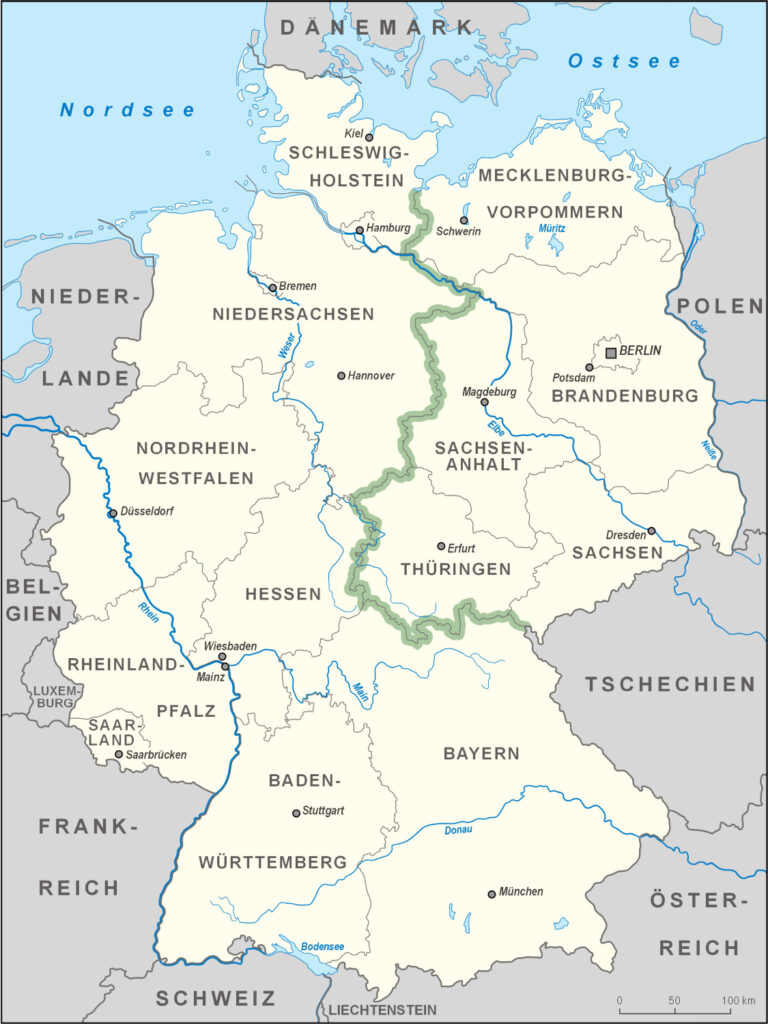 A beige map features the country of Germany with place names and a green line cutting through it.