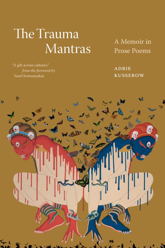 A camel-brown book cover features two kneeling, barefoot human-like figures facing away from each other. Wearing headbands with skulls and covered in butterflies and snakes, the figure on the left has red skin and the one on the right has blue skin. Above the image, white text reads, “The Trauma Mantras: A Memoir in Prose Poems, Adrie Kusserow.” In quotation marks, italicized white text also reads, “‘A gift across cultures,’ from the foreword by Yusef Komunyakaa.”