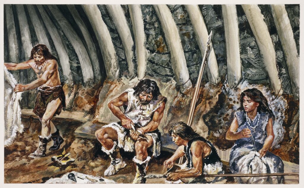 A color illustration depicts Paleolithic people clad in furs inside an ancient dwelling as they perform various tasks, including making a spear and sewing.