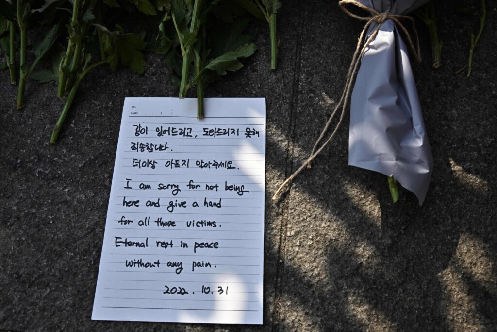 A handwritten note reads: “I am sorry for not being here and give a hand for all those victims. Eternal rest in peace without any pain.”
